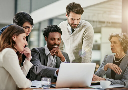 Laptop, meeting and team of business people in office planning stock market investment for company. Computer, collaboration and group of financial brokers working on finance account in workplace.