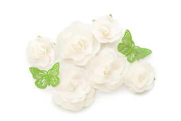Flowers made of fabric and green plastic butterflies on white background