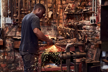 Blacksmith, factory and manufacturing for steel or iron, table and forging for metalwork, handcraft...