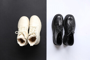 Black and white boots on colorful background. Top view