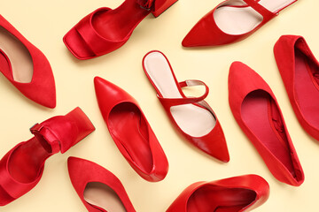 Red woman's shoes on beige background. Top view