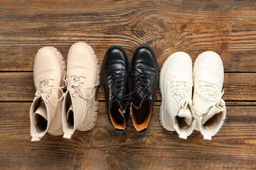 Boots on wooden background. Top view