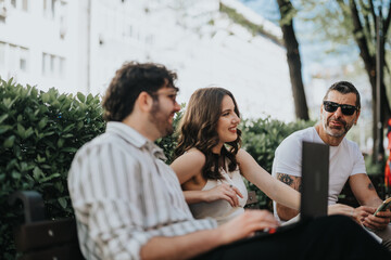 Fototapeta premium Company executives on a bench outdoors, enjoying a sunny day while on a work break
