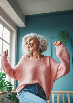 happy modern dancing senior woman in home, smiling and active woman 