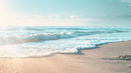 Obraz premium Serene beach waves at sunset. Tranquil ocean waves gently rolling onto a sandy beach, illuminated by golden sunset light.