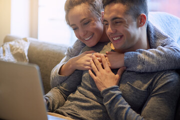 Smile, couple and relax on sofa at house together in living room with affection, bonding and love...