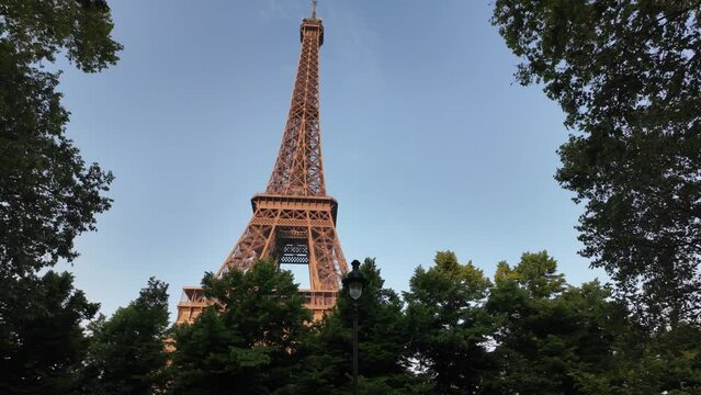 Image of Paris and the Eiffel Tower between buildings, unique point of view, city architecture. Capital of the 2024 Olympics. Paris 2024 Olympic Games.