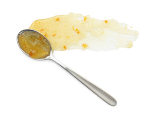 Tasty sweet jam and spoon isolated on white, top view