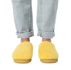 Woman in yellow soft slippers on white background, closeup
