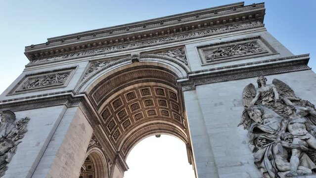 The Arc de Triomphe in Paris, its iconic architecture. Perfect for showcasing Paris, tourism, 