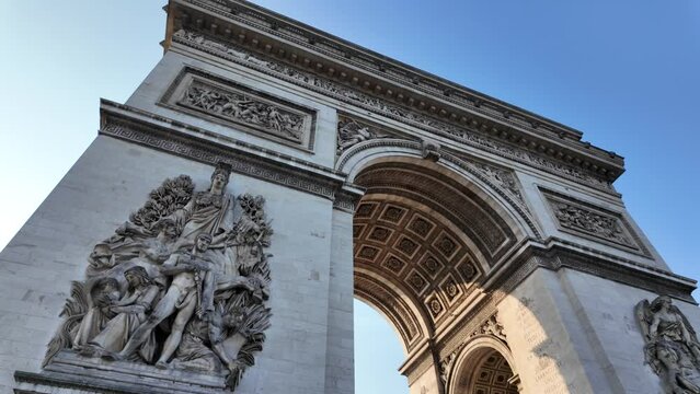 The Arc de Triomphe in Paris, captured from various angles at dawn, highlighting its iconic architecture. Perfect for showcasing Paris, tourism, and the upcoming Olympic Games