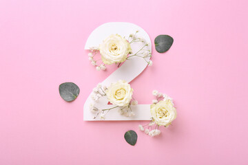 Paper number 2, eucalyptus leaves and beautiful flowers on pink background, flat lay