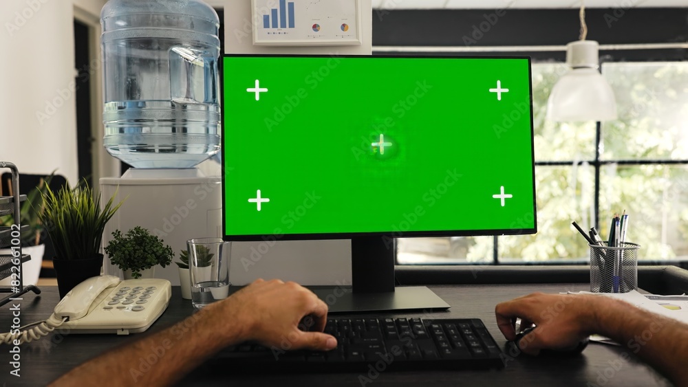 Poster pov of man at desk works with greenscreen and isolated copyspace template, solving business tasks. c