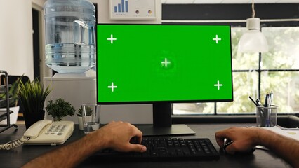 POV of man at desk works with greenscreen and isolated copyspace template, solving business tasks....