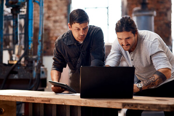 Research, laptop or people in factory for blacksmith planning, labor or warehouse trade in small business. Tablet, teamwork or metal workers in workshop on technology for production or steel industry