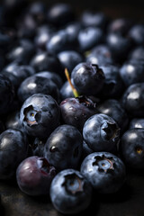 Fresh blueberries vertical background with copy space. Organic farm food, vegetarian, fresh market, healthy products. Macro, close up.