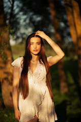 Long-haired brunette in nature portraits