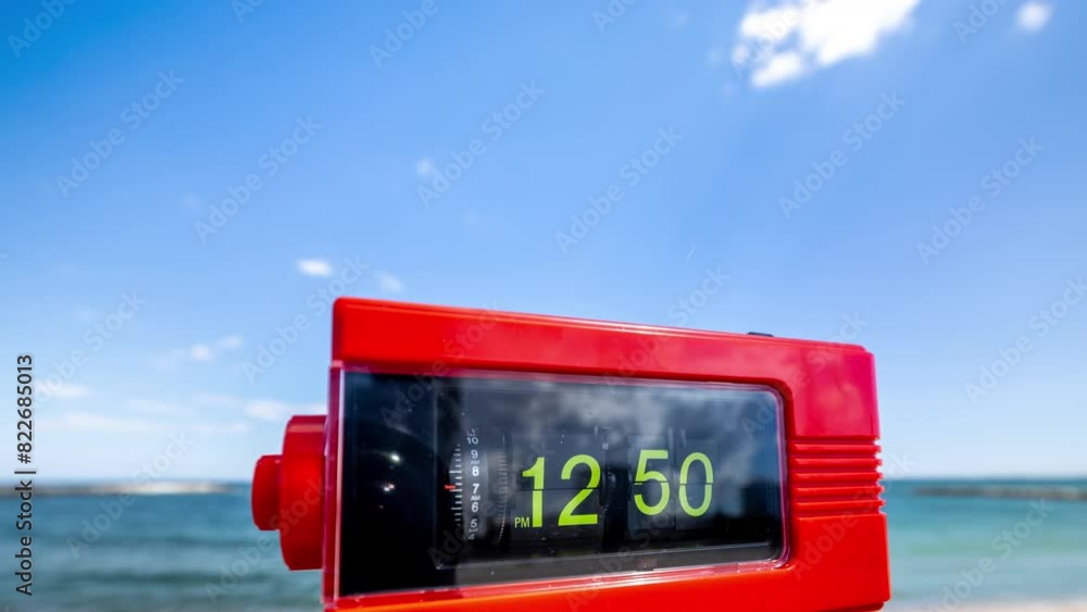Aufkleber flip clock with time passing on a beach with sky and sea in background