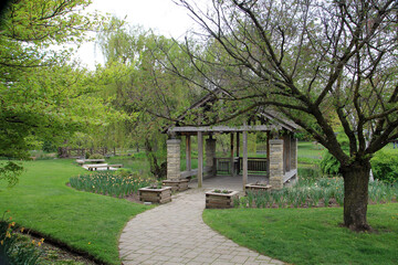 Spring landscape with ruin and trees in the park