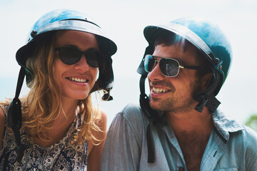 Smile, sunglasses and happy couple outdoor with helmet for relationship, summer sunshine and...