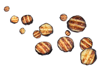 Slices of grilled eggplants in air on white background