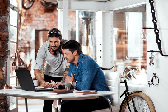 Business people, computer and teamwork in workshop for startup collaboration, brainstorming and training. Worker or craftsman with laptop talking, planning and research of steel industry and trade