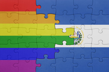 puzzle with the colourful national flag of el salvador and rainbow gay pride flag .