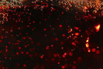 Macro shot of bubbles in fizzy cola drink