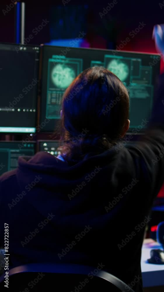 Poster vertical video happy hacker in secret hideout celebrating after managing to hide online activity aft