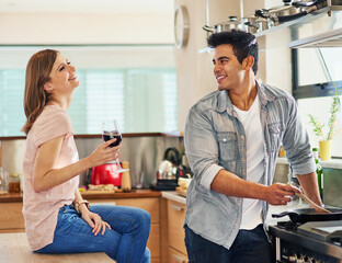 Happy, couple cooking and drinking alcohol together for bonding in kitchen over romantic meal...