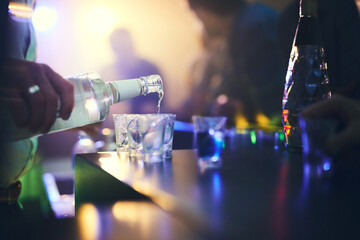 Barman, spirits and pour alcohol in night club for service, order and counter server with...