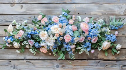 elegant blue and pink pastel floral arrangement on wooden table top view spring wedding or mothers day concept photo