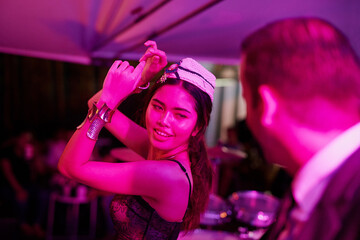 Music, dance and Asian woman in nightclub with lights at disco event, celebration or concert....