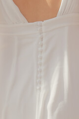Buttons on the back of a wedding dress