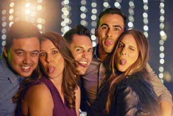 Fototapeta premium Friends, people and happy in nightclub on portrait with light, fun and night out for break, party and enjoy. Disco, entertainment and happy at pub for nightlife on date, bonding and love or support