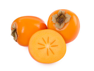 Whole and cut persimmon fruits isolated on white