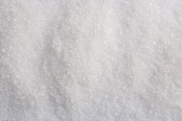 White natural salt as background, top view