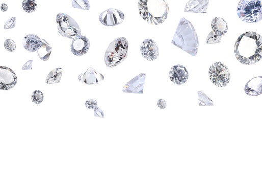 Beautiful shiny diamonds in air on white background