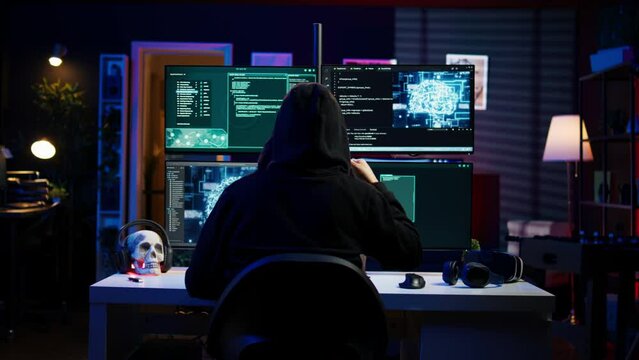 Cybercriminal using AI machine learning to develop zero day exploit undetectable by antivirus software. Hacker using artificial intelligence technology to build script tricking firewalls, camera B