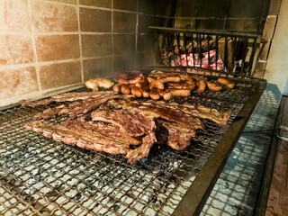 Meat cooked on a wood-fired barbecue