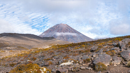 Dramatic landscape of rugged volcanic terrain with Mount Ngauruhoe, Mount Doom, iconic hiking spot in Tongariro National Park, New Zealand