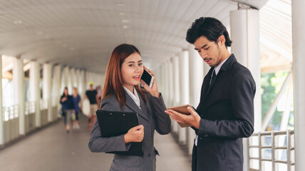 Group of Asian business people diversity talking meeting outside office. Multiethnic teamwork collaboration team meeting. Business people shaking hands together diversity multiethnic Business partner