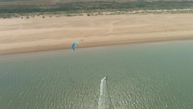 4K aerial view of a kite surfer Ouddorp beach, in the Netherlands.