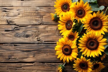 Obraz premium Sunflowers on Rustic Wooden Background