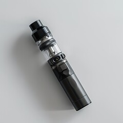 A modern e-cigarette lying on a plain white background showcasing its design and components
