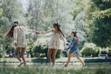 An outdoor capture of three joyful friends, dancing and holding hands in a park on a sunny day, embodying freedom and happiness.