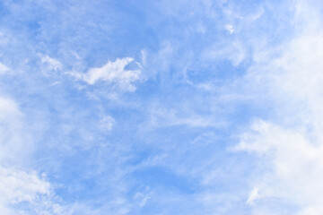 beautiful blue sky and white fluffy group of clouds with sunrise in the morning, natural background