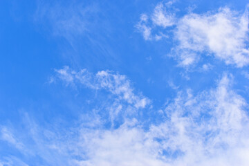 beautiful blue sky and white fluffy group of clouds with sunrise in the morning, natural background