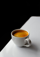 Elegant Coffee Cup with Fresh Beans on Modern Black and White Surface