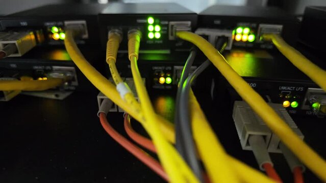 Fiber optic cables for connecting multi-mode and single-mode networks and communications systems with media converters and background lighting.